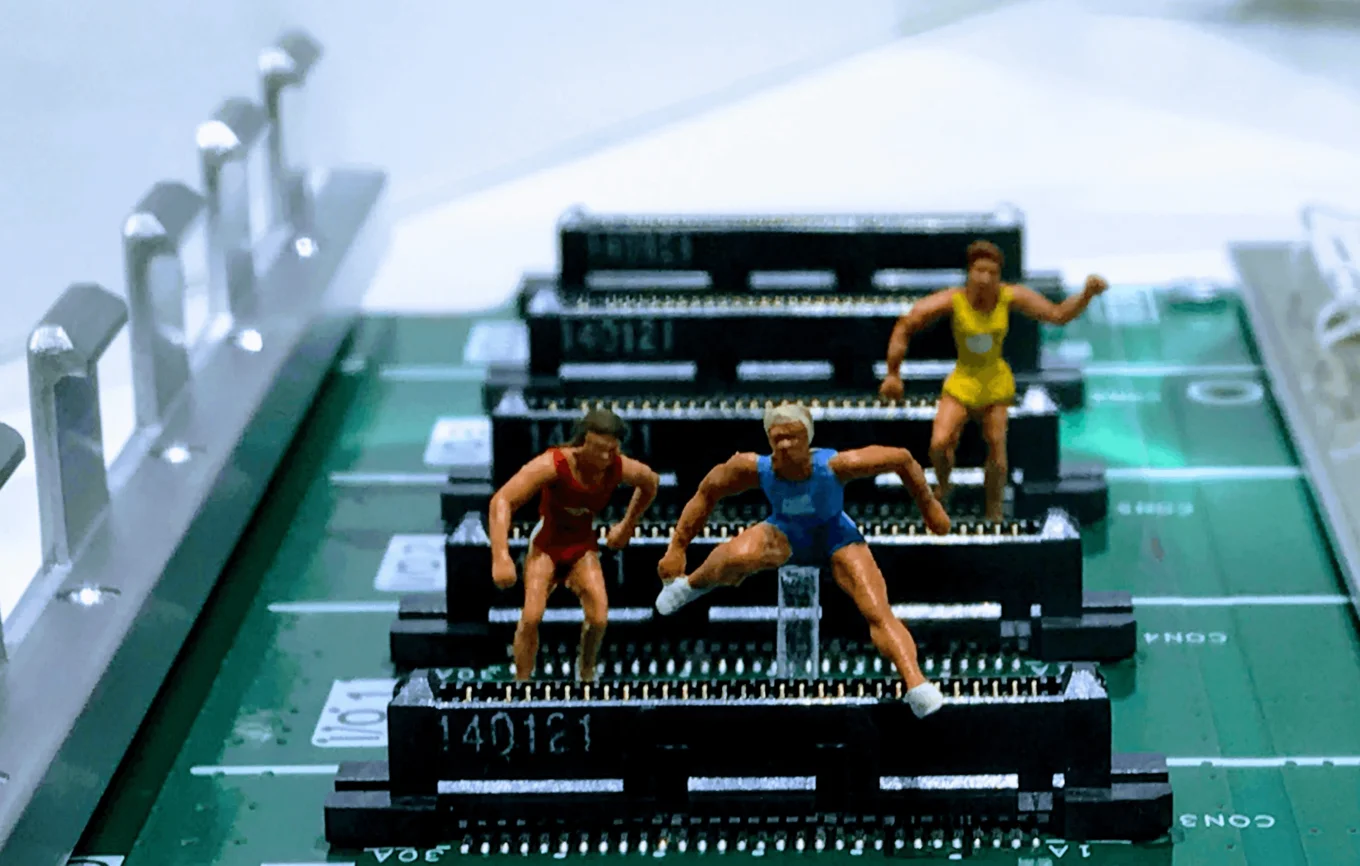 Miniature figures running on circuit board chips.